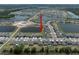 A picturesque aerial view shows the property's location, nearby ponds, and the surrounding residential neighborhood at 13227 Great Plains Dr, Riverview, FL 33579