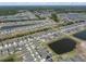 Community aerial view showcasing tightly packed neighborhood and a nearby pond at 13227 Great Plains Dr, Riverview, FL 33579