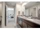 Bathroom features a granite countertop, double vanity sinks and neutral tile at 13227 Great Plains Dr, Riverview, FL 33579
