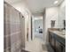 En Suite bath features dual sinks, linen closet and tile flooring at 13227 Great Plains Dr, Riverview, FL 33579