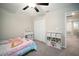 Bedroom with neutral decor, a ceiling fan, and lots of storage cubes at 13227 Great Plains Dr, Riverview, FL 33579