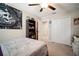 Neutral bedroom with a ceiling fan and closet with double doors at 13227 Great Plains Dr, Riverview, FL 33579