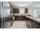 Well-equipped kitchen featuring stainless steel appliances, granite countertops, and plenty of cabinet space for storage at 13227 Great Plains Dr, Riverview, FL 33579