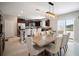 Well-equipped kitchen featuring stainless steel appliances, ample counter space, and a dining area at 13227 Great Plains Dr, Riverview, FL 33579