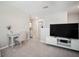 Bright living area features neutral walls, carpeted floor and media center at 13227 Great Plains Dr, Riverview, FL 33579