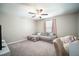 Cozy living room featuring neutral color with a ceiling fan, creating a comfortable and inviting space at 13227 Great Plains Dr, Riverview, FL 33579