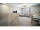 Cozy seating area is brightened by natural light and neutral decor at 13227 Great Plains Dr, Riverview, FL 33579