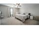 Bright main bedroom features a large bed, nightstands and dresser at 13227 Great Plains Dr, Riverview, FL 33579