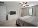 Large main bedroom boasts a king bed, window and vanity at 13227 Great Plains Dr, Riverview, FL 33579