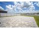 Spacious concrete patio with a white vinyl fence, perfect for outdoor entertaining at 13227 Great Plains Dr, Riverview, FL 33579
