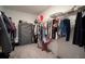 Well-organized walk-in closet offers ample storage space for clothing and accessories at 13227 Great Plains Dr, Riverview, FL 33579