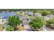 An aerial view of a home with a view of a nearby pond and a neighborhood at 13511 Fladgate Mark Dr, Riverview, FL 33579
