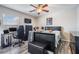 Bedroom featuring a bed, desk, ceiling fan, and dark wood-look flooring at 13511 Fladgate Mark Dr, Riverview, FL 33579