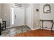Inviting entryway featuring tiled floors, a front door with sidelight, closet, and decorative details at 13511 Fladgate Mark Dr, Riverview, FL 33579