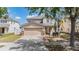 Charming two-story home with a two-car garage, landscaped yard, and inviting entryway in a well-maintained neighborhood at 13511 Fladgate Mark Dr, Riverview, FL 33579