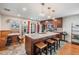 The kitchen features an island with barstool seating, stainless appliances, custom cabinets, and a breakfast nook at 13511 Fladgate Mark Dr, Riverview, FL 33579