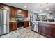 Updated kitchen with stainless steel appliances, custom cabinets, and an island with a sink and dishwasher at 13511 Fladgate Mark Dr, Riverview, FL 33579