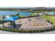 Community playground with a variety of play structures, swings, and seating areas, perfect for Gathering fun at 13511 Fladgate Mark Dr, Riverview, FL 33579