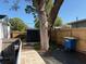 Backyard featuring an outdoor storage shed, a wooden fence, and a brick pathway, creating a functional outdoor area at 1408 San Juan Ct, Clearwater, FL 33756