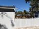 Backyard featuring a white fence and lush landscaping offering privacy and a serene outdoor retreat at 1408 San Juan Ct, Clearwater, FL 33756