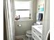 Bright bathroom with a window above the toilet and a white vanity at 1408 San Juan Ct, Clearwater, FL 33756
