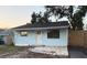 Charming home featuring a quaint entryway, simple design, and inviting facade at 1408 San Juan Ct, Clearwater, FL 33756