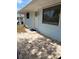 Light blue home with brick patio in front and window near door at 1408 San Juan Ct, Clearwater, FL 33756