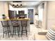 Cozy kitchen featuring bar stool seating, stainless steel appliances, and wood countertops at 1408 San Juan Ct, Clearwater, FL 33756
