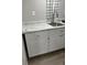 A kitchen area with cabinets and a faucet at 1408 San Juan Ct, Clearwater, FL 33756