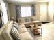 Inviting living room featuring neutral sofas and modern decor at 1408 San Juan Ct, Clearwater, FL 33756