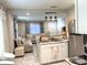 Open-concept kitchen and living room with bar seating at 1408 San Juan Ct, Clearwater, FL 33756