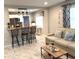Bright, open living space with breakfast bar, sofas, and bar stool seating at 1408 San Juan Ct, Clearwater, FL 33756