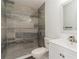 Bathroom featuring tile shower, white sink and toilet at 14319 Morristown Ave, Port Charlotte, FL 33981