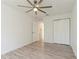 Bedroom featuring hardwood floors, an open door, and a closet at 14319 Morristown Ave, Port Charlotte, FL 33981