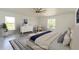 Bright staged bedroom featuring hardwood floors, natural light, and tasteful decor at 14319 Morristown Ave, Port Charlotte, FL 33981