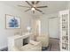 Staged office featuring a white desk, shelving, and light colored furniture at 14319 Morristown Ave, Port Charlotte, FL 33981