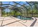 Enclosed pool with an outdoor grill and lots of sunshine at 14319 Morristown Ave, Port Charlotte, FL 33981