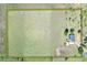Aerial view of the property, surrounded by expansive land, showcasing its potential for outdoor activities and privacy at 14655 Joe Sumner Rd, Wimauma, FL 33598