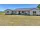 Charming exterior of a ranch-style home featuring a covered porch, perfect for relaxing and enjoying the outdoors at 14655 Joe Sumner Rd, Wimauma, FL 33598