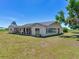 Exterior showcasing large windows and a covered porch, perfect for enjoying views of the scenic surroundings at 14655 Joe Sumner Rd, Wimauma, FL 33598