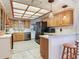 Bright kitchen with stainless steel appliances and warm wood cabinets, perfect for cooking and entertaining at 14655 Joe Sumner Rd, Wimauma, FL 33598