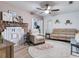 Cozy living room with a brick fireplace, plush seating, and decorative accents, offering a comfortable retreat at 14655 Joe Sumner Rd, Wimauma, FL 33598