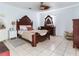 Spacious bedroom with elegant wooden furniture and serene decor, creating a relaxing and comfortable retreat at 14655 Joe Sumner Rd, Wimauma, FL 33598