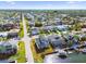 Aerial view of waterfront home with adjacent canal access and neighborhood setting at 15621 Bertram Dr, Hudson, FL 34667