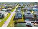 Aerial view of waterfront neighborhood with canal access, mature trees, and well-maintained homes at 15621 Bertram Dr, Hudson, FL 34667