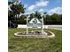 Welcome to Sea Pines! A beautiful community sign with lush landscaping and inviting entrance at 15621 Bertram Dr, Hudson, FL 34667