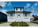 Charming waterfront home with two-car garage, white facade, and inviting front entry at 15621 Bertram Dr, Hudson, FL 34667