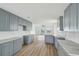 Spacious kitchen with light gray cabinets, stone countertops and a view to the water at 15621 Bertram Dr, Hudson, FL 34667