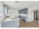 Beautiful kitchen with an island, gray cabinets, and sliding doors to backyard at 15621 Bertram Dr, Hudson, FL 34667