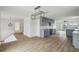Renovated kitchen features modern gray cabinets, new hardwood floors, and recessed lighting at 15621 Bertram Dr, Hudson, FL 34667